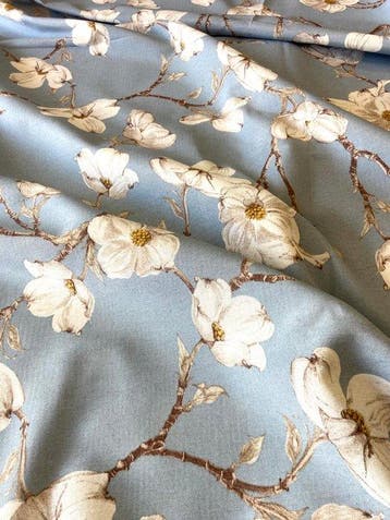 Meubilstof met een elegant magnolia-bloemmotief. - Textiel -