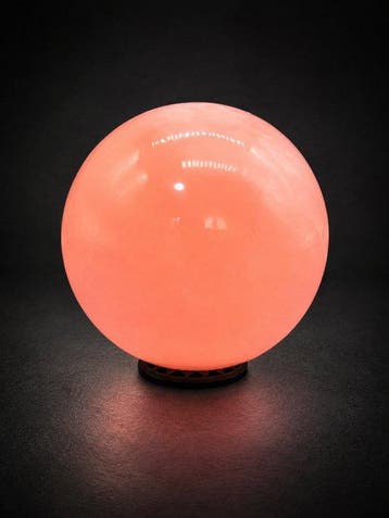 Fluorescerende mangaancalciet kristallen bol | Intens
