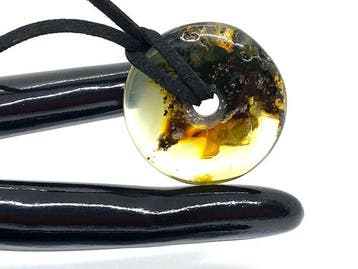 Pendentif en ambre baltique en forme de donut – inclusions