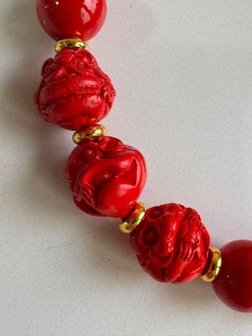 Koraalarmband met centrale kralen van de Chinese dierenriem: