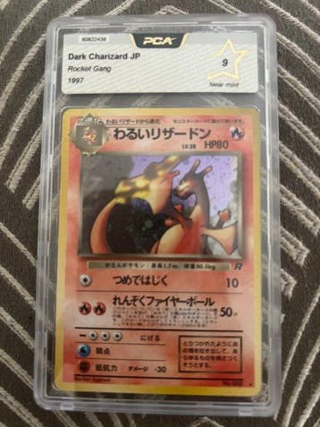 Pokémon - 1 Graded card - Dark charizard rocket gang 1997 -