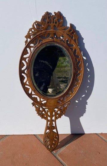 Hand mirror in carved, inlaid, and pyrography-decorated