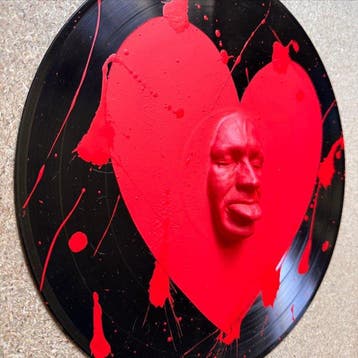 gregos - Red mockery heart on vinyl record