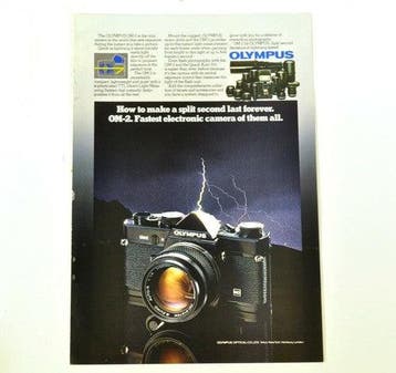 Vintage Olympus OM-2 camera – reclame uit 1978, Collections, Verzenden