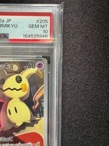 Pokémon - 1 Graded card - Team Rockets Mimikyu 205/193 -
