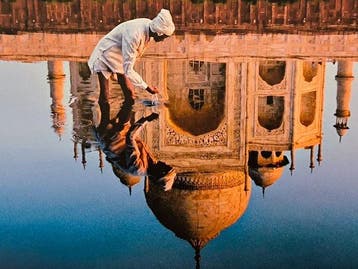 Steve McCurry (1950–) - Reflection of the Taj Mahal in Agra.