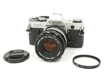 Canon AE-1 + FD 50mm f/1.8 S.C. Lens + 2X CFC Teleplus MC4, Nieuw