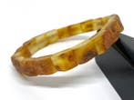 L’Héritage de la Terre : Bracelet chef-d’œuvre en ambre