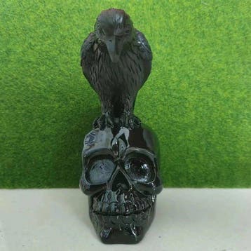 Hand-Carved Raven on Skull Sculpture – African Gothic Resin