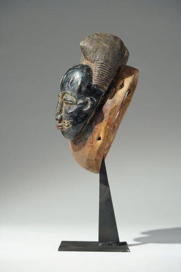 Een houten masker - Geheimhoudingsovereenkomst - Baule -