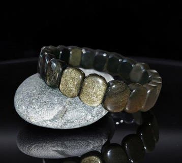 Hoogwaardige armband van gouden obsidiaan. Natuurlijke