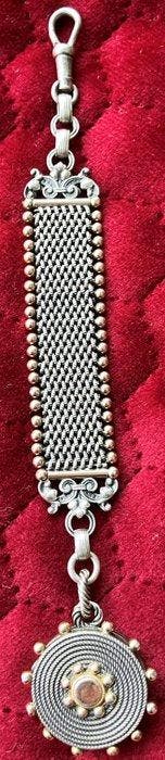 Zilveren horlogeketting zgn. chatelaine met medaillion, 19e