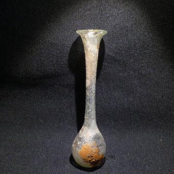Oud-Romeins Glas Fles. 11 cm hoog. 1e - 2e eeuw na Chr.