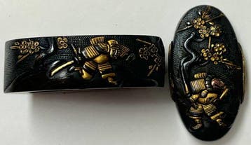 shakudo samurai gevecht onder ume-bloesemboom motief fuchi