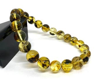Bracelet en perles rondes dambre balte avec inclusions de
