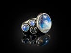 Cabochons en pierre lune arc-en-ciel et en diopside noir