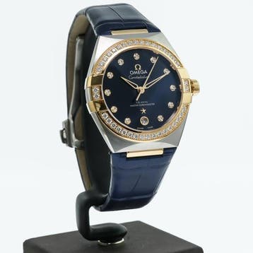 OMEGA – 36 mm, stainless steel – yellow gold on leather