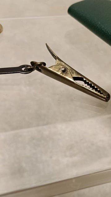 Vintage pocket postal scales (pendulum-style letter scales).