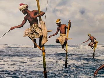 Steve McCurry (1950–) - Fishermen at Weligama. Sri Lanka,