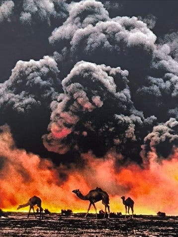 Steve McCurry (1950–) - Camels in burning oil fields in