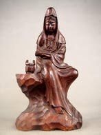 Kannon Bodhisattva wearing white robes and holding a