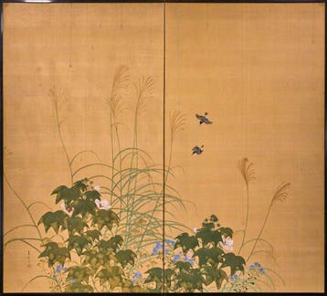 Un paravent japonais à deux panneaux avec des fleurs