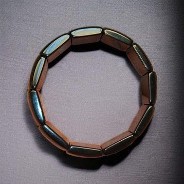 Hoogwaardige goudkleurige obsidiaanarmband. Natuurlijke