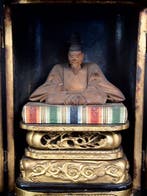 Statue of Sugawara no Michizane enshrined in a shrine -