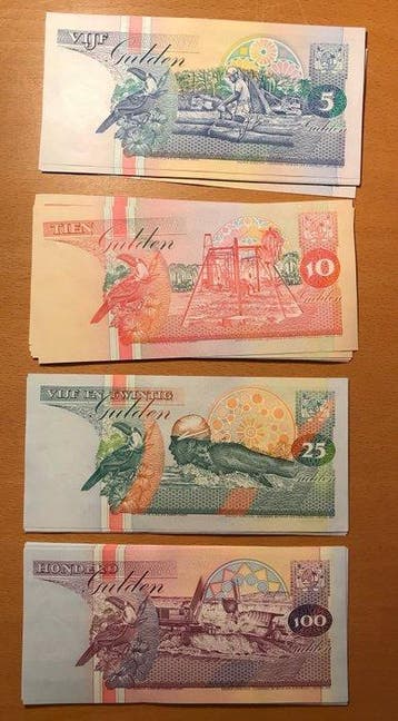 Suriname. - 20 x 5, 20 x 10, 20 x 25 and 20 x 100 Gulden