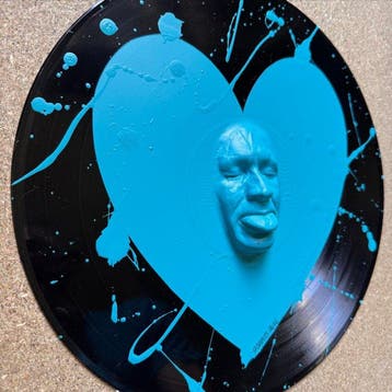 gregos - Blue light mockery heart on vinyl record