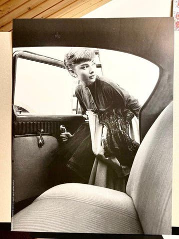 Bob Willoughby - Audrey Hepburn 1954 getting into the car.