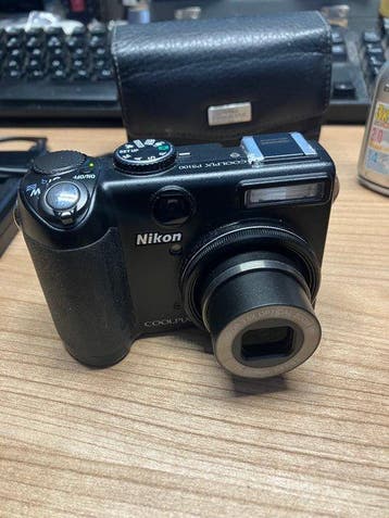 Nikon COOLPIX P5100 /COOLPIX E2100 with charger ,2 batteries