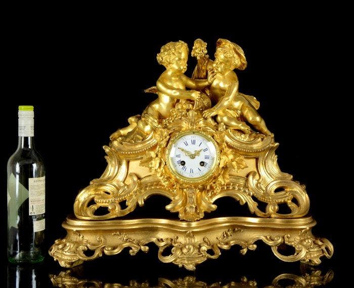 Een grote Cherubs mantelklok - S. Marti Rococo Verguld, Antiquités & Art, Antiquités | Horloges