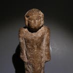 Oud-Egyptisch Kalksteen Beeld van een man. 15 cm lang. Derde