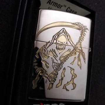 Zippo - The Death Boss, two different golden/silver reliefs,, Nieuw