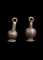 Oude Egypte, Nieuwe rijk Zilver Papaver Amulet Paar