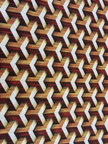 Geometrische illusie in amber- en roesttinten - Meubelstof -