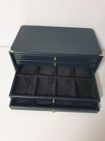 Accessoires. Black eco-leather coin cabinet for 32 places