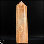 Obélisque majestueux en pierre de lune pêche – un symbole de