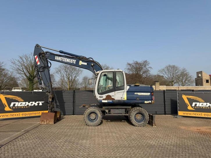 Veiling: Wielgraafmachine New Holland Kobelco MH PLUS C Dies, Articles professionnels, Machines & Construction | Grues & Excavatrices