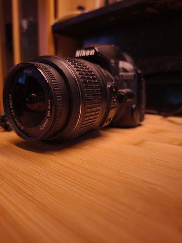 Nikon D3100 + AF-S 18-55mm VR Digitale reflex camera (DSLR), Audio, Tv en Foto, Nieuw