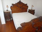 A carved and stained wood three-piece bedroom, comprising