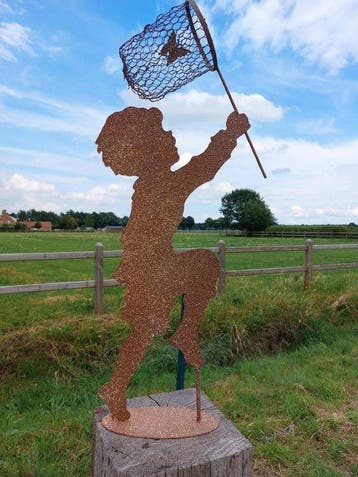 Statue, garden statue silhouette of boy with butterfly net -