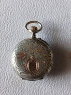 Reloj labrado en Plata y Oro. - 1850-1900