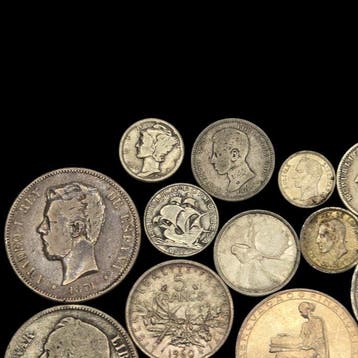 Wereld. Lote de 227 gramos de monedas de plata.