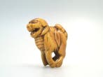 Netsuke rare et grand représentant un Shishi debout - Ramure, Antiek en Kunst