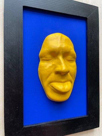 gregos - Yellow mockery on blue background-black frame