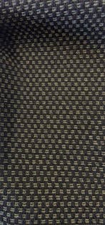 Grof geweven stof met donkergrijs en licht olijfgroen. -