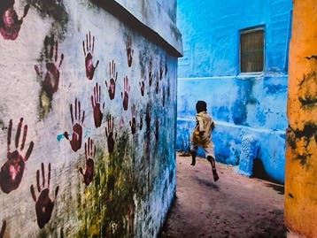 Steve McCurry (1950–) - Boy in mid-flight in Jodhpur. India,