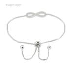 Witte armband met infinity symbool rond gezet met., Handtassen en Accessoires, Overige Accessoires, Ophalen, Nieuw